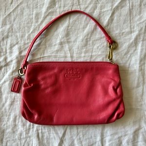 Coach pink wristlet in very good condition.